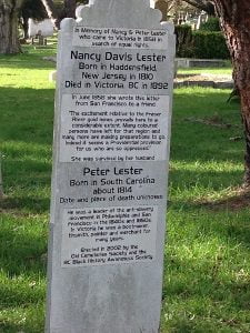 grave marker standing white marker with black type face