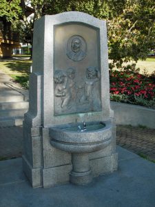 Concrete fountain, engraved high back with fountain protrusion in front