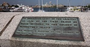 bronze plaque inlaid on top of concrete causeway wall
