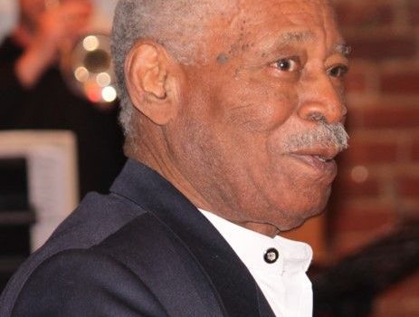 Portrait of senior man in formal wear with carnation in lapel