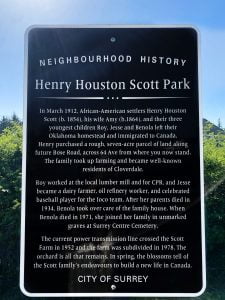 Historical plaque on post white lettering on black background