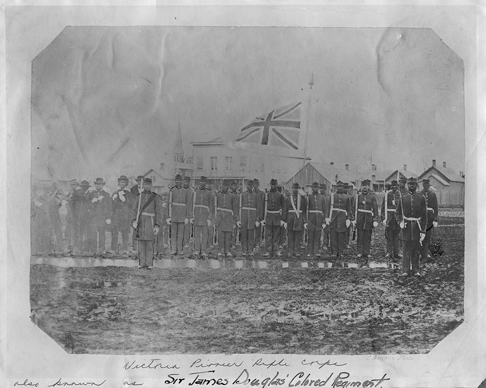 Victoria Pioneer Rifle Corps standing in ranks with band members