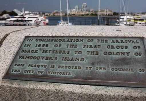 bronze plaque inlaid on top of concrete causeway wall