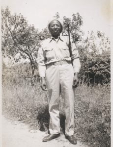 b&w middle aged man standing in military uniform