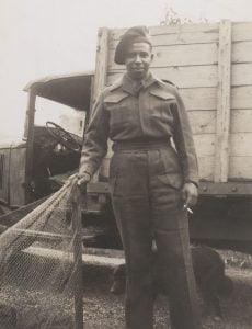 b&w young man standing in military uniform