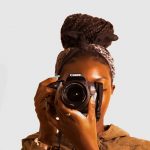 Black women facing forward - focusing-taking picture
