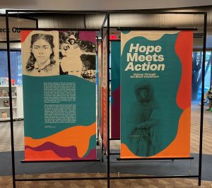 2 6-foot high, self-standing, information panels supported and connected by rigid metal frames with title and text about the exhibit