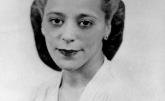 b&w headshot Black women with v-neck light dress, 1940 hair styled