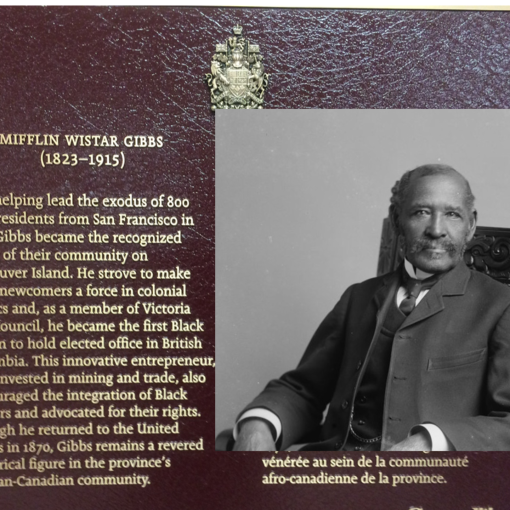 plaque on left side, portrait of Gibbs on right side