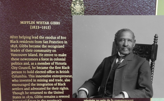 plaque on left side, portrait of Gibbs on right side